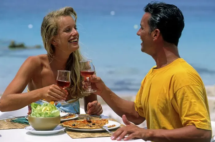 Framed Print : Couple eating by the sea