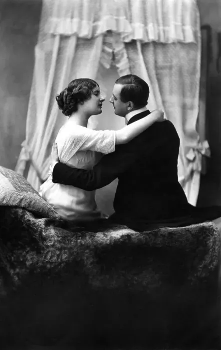 Framed Print : Couple, lovers flirting on a sofa, c Framed Print : Couple, lovers flirting on a sofa, c
