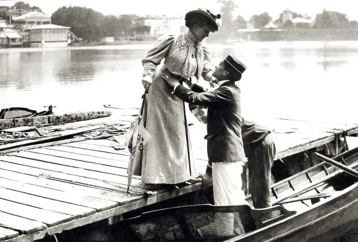 Framed Print : Couple, man helps woman into boat Framed Print : Couple, man helps woman into boat