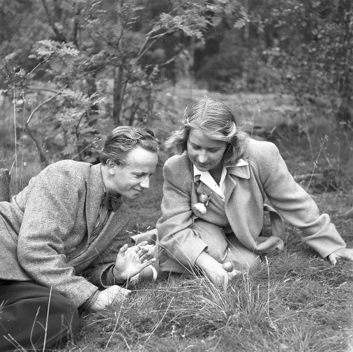 Framed Print : Couple in the nature. A young couple pictured sitting on the ground looking at a mushroom. Sweden 1944. Kristoffersson Ref M20-2
