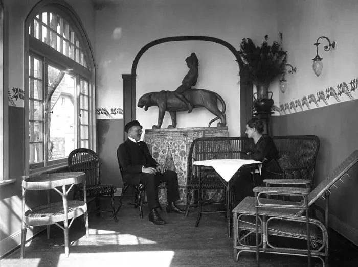 Framed Print : Couple sits in winter garden and converses