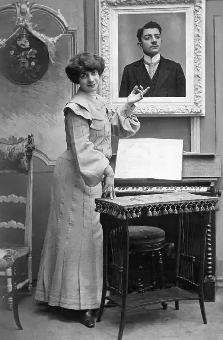 Framed Print : Couple, a woman points to the photo of her lover Framed Print : Couple, a woman points to the photo of her lover