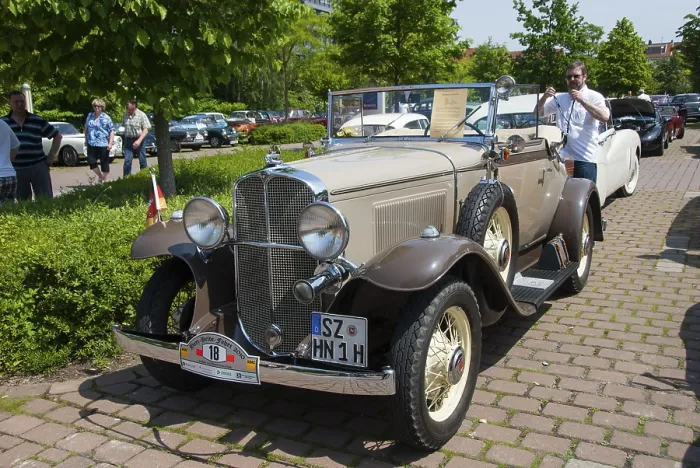 Framed Print : Cream-coloured convertible in a sunny ambience