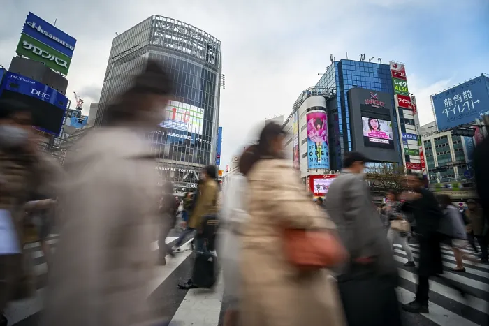 Framed Print : Crowd crossing zebra crossing on a large intersection Framed Print : Crowd crossing zebra crossing on a large intersection