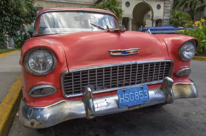 Framed Print : For Cuba typical old US classic car Chevrolet with weathered red paint
