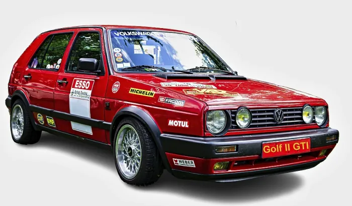Framed Print : Customized red Volkswagen Golf II GTI posing on a white background