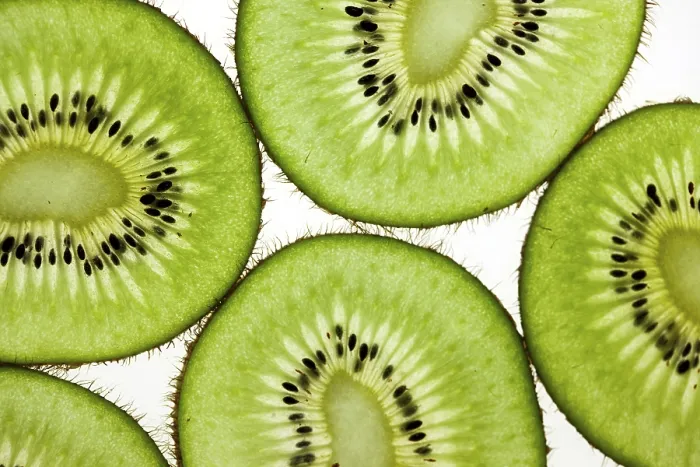 Framed Print : Cut kiwi against a white background Studio shot Framed Print : Cut kiwi against a white background Studio shot