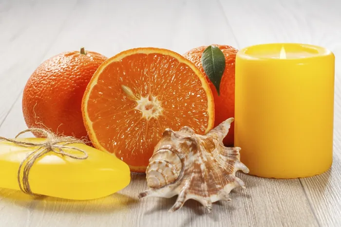 Framed Print : Cut orange with two whole oranges