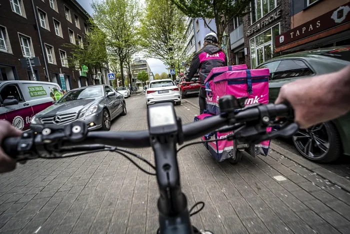 Framed Print : Cycling in the city, inner-city street