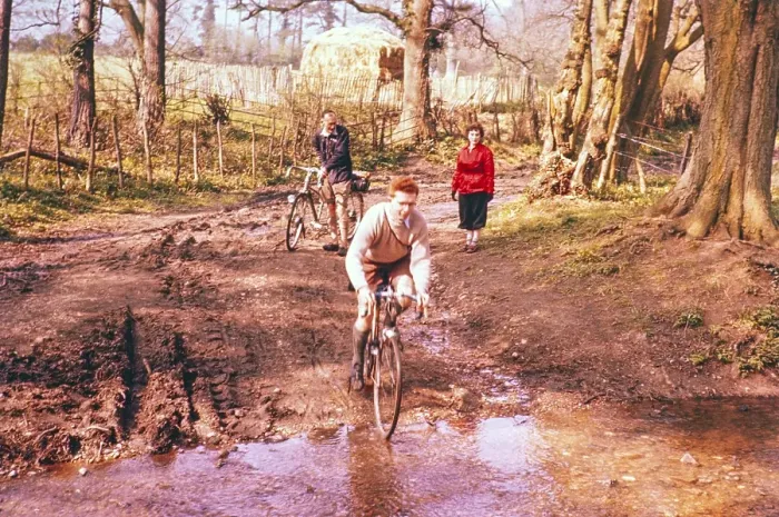 Framed Print : Cyclist on a country lane crossing a stream, South England, Great Britain 1957 Framed Print : Cyclist on a country lane crossing a stream, South England, Great Britain 1957