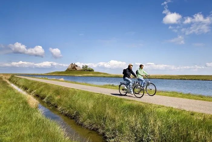 Framed Print : Cyclist in front of Kirchwarft dwelling mound Framed Print : Cyclist in front of Kirchwarft dwelling mound