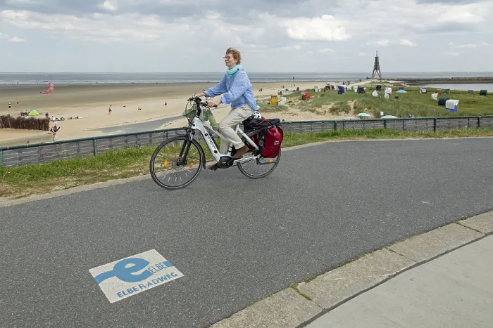 Framed Print : Cyclist, marking, start or end of Elbe cycle path Framed Print : Cyclist, marking, start or end of Elbe cycle path