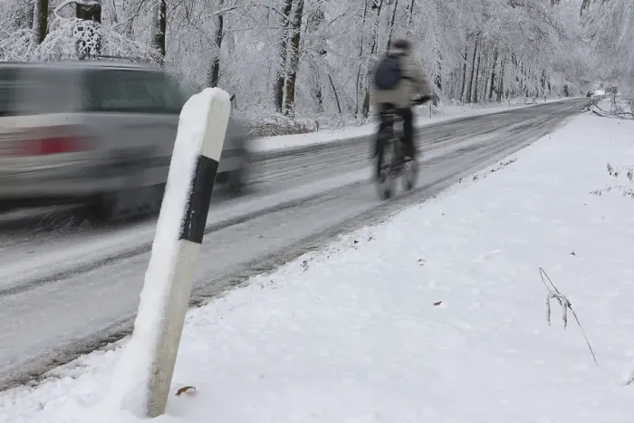 Framed Print : Cyclist being overtaken on a snowy country road in winter Framed Print : Cyclist being overtaken on a snowy country road in winter