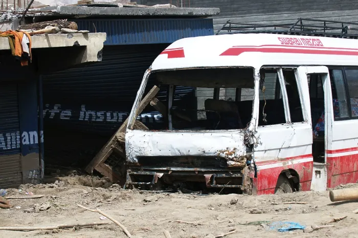 Framed Print : Damaged bus stuck in mud at choglamsar due to flashflood