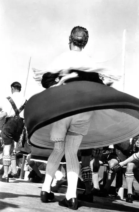 Framed Print : Dance in Bavarian traditional costume with view under the skirt Framed Print : Dance in Bavarian traditional costume with view under the skirt