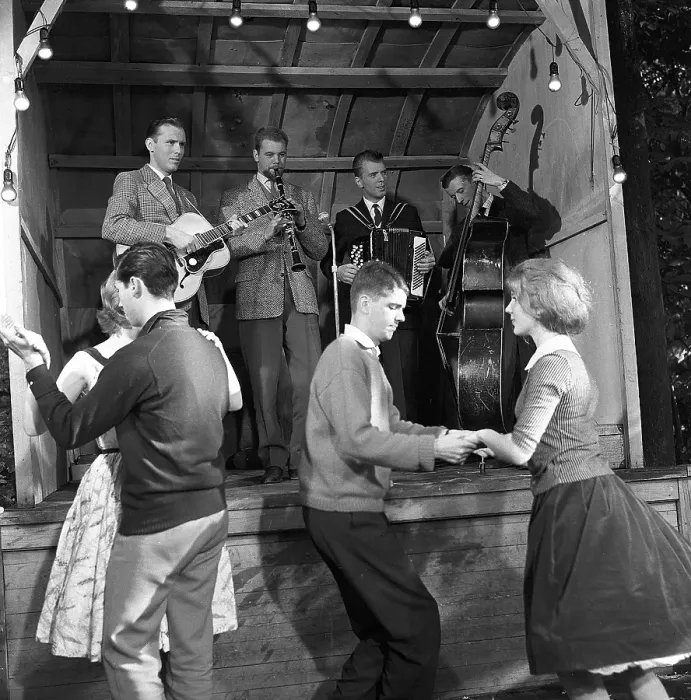 Framed Print : Dancing in the 1950s. A nice outdoor summer dance event where young couples are dancing and having fun