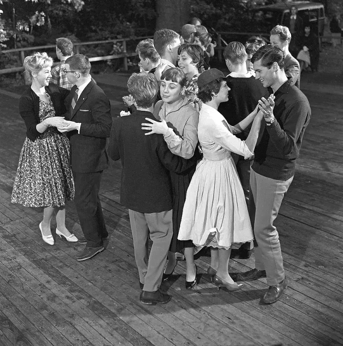 Framed Print : Dancing in the 1950s. A nice outdoor summer dance event where young couples are dancing and having fun