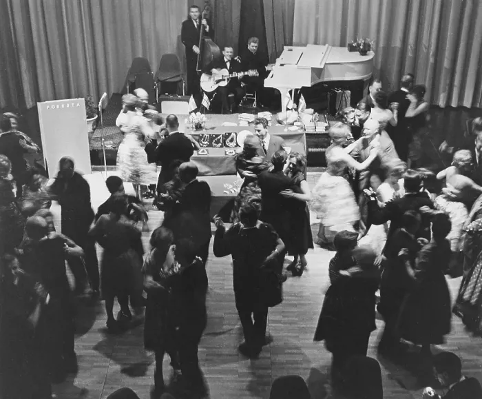 Framed Print : Dancing in the 1960s. A band is playing and the dance floor is filled with dancing couples that are enjoying themselves