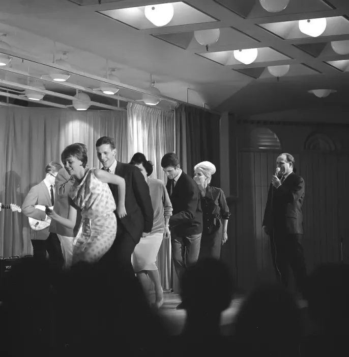 Framed Print : Dancing in the 1960s. The dance Hully Gully is being made popular and here are men and women dancing the new craze