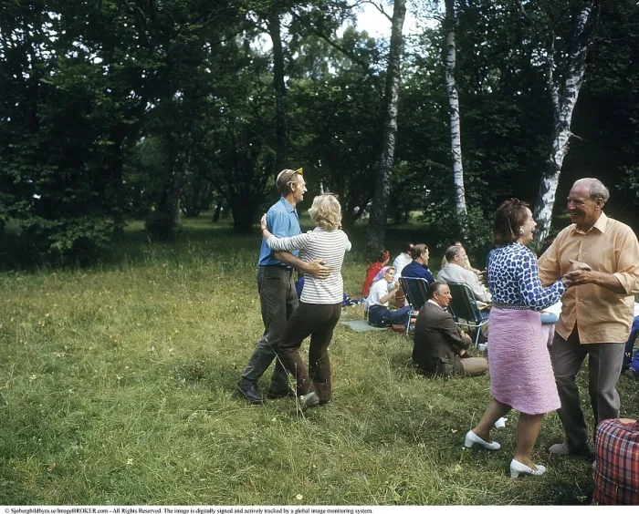 Framed Print : Dancing in the 1970s. Its a summer day and the dancing take place outdoors on the grass