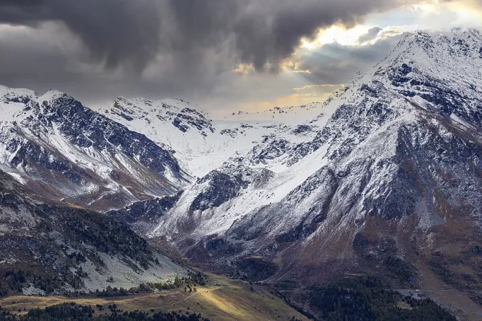 Framed Print : Dark clouds over the snow-covered mountains above Saint Luc