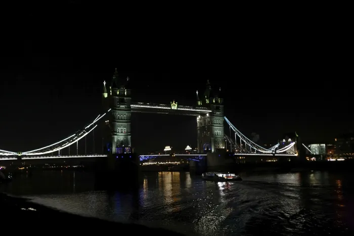Framed Print : Darkened River Thames scene with the illuminated Tower Bridge creating a striking visual effect in London