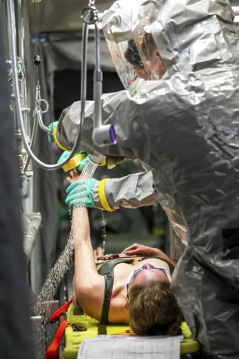 Framed Print : Decontamination of injured persons after an assumed accident involving hazardous substances