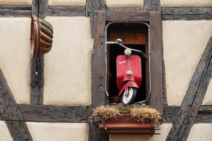 Framed Print : Decorated window on a half-timbered house in the historic old town of Riquewihr Framed Print : Decorated window on a half-timbered house in the historic old town of Riquewihr