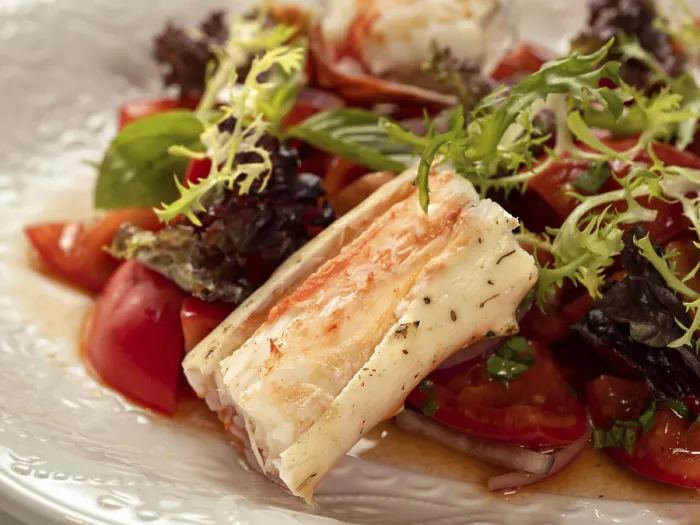 Framed Print : Delicious seafood crab salad on white plate on restaurant table background