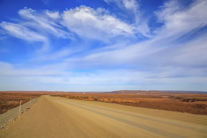 Framed Print : The Dempster Highway crossing the arctic tundra just north of the Yukon border