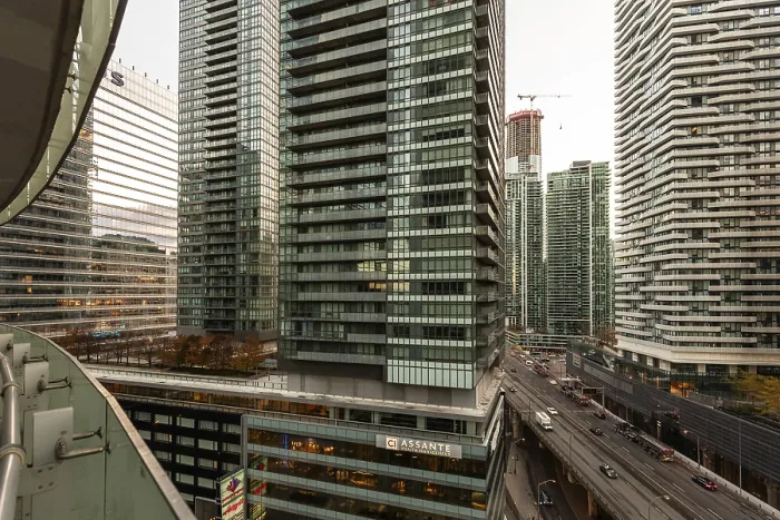 Framed Print : Dense urban skyline featuring towering modern skyscrapers and a busy roadway below in Toronto Framed Print : Dense urban skyline featuring towering modern skyscrapers and a busy roadway below in Toronto