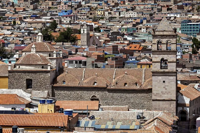 Framed Print : Densely built-up city scene with brick towers and colonial architecture in the foreground