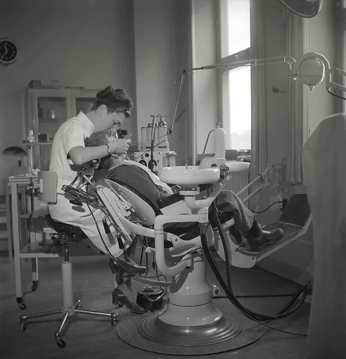 Framed Print : At the dentist in the 1940s. A boy is being examined and treated by a dentist Framed Print : At the dentist in the 1940s. A boy is being examined and treated by a dentist
