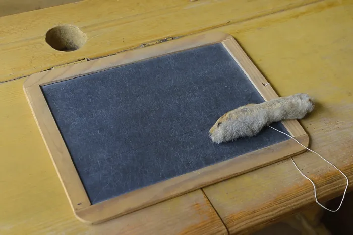 Framed Print : Desk with slate board and rabbit's foot