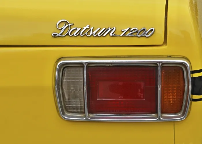 Framed Print : Detail, rear light and lettering of a Daatsun 1200 from the 70s