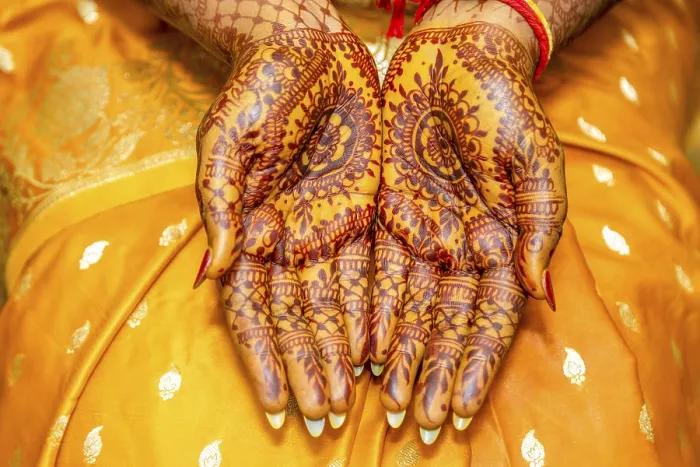 Framed Print : The detailed henna art on the hands is a beautiful display of cultural heritage and artistic skill