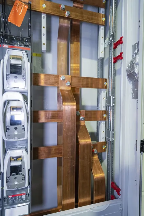 Framed Print : Detailed view of copper rods in an industrial cable cabinet
