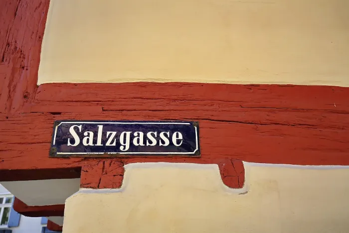 Framed Print : Detailed view of a road sign on a half-timbered house