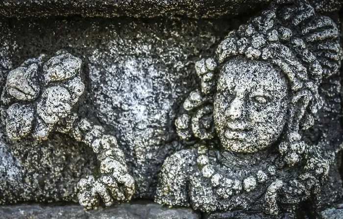 Framed Print : Details of sculptures and reliefs on the walls of the Borobudur temple in Java