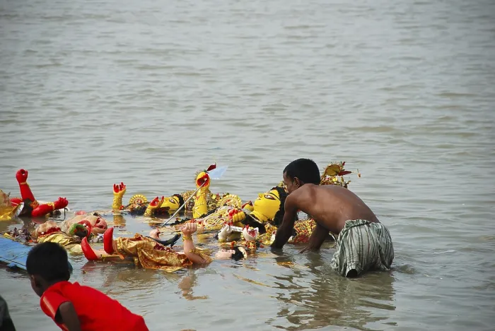 Framed Print : Devotees immersing Durga model in river Framed Print : Devotees immersing Durga model in river