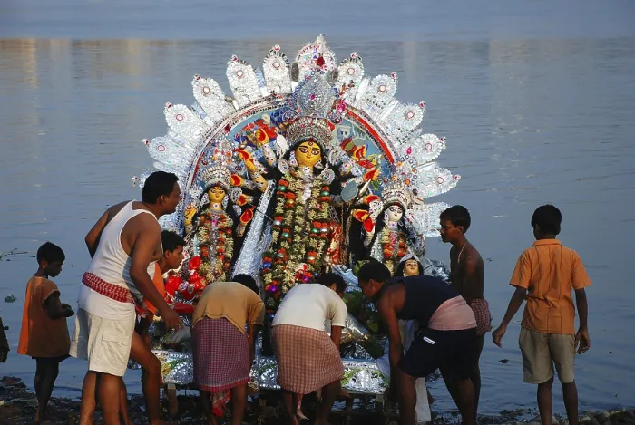 Framed Print : Devotees immersing Durga model in river Framed Print : Devotees immersing Durga model in river