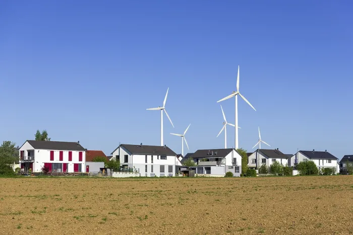 Framed Print : Digital Composing, new housing estate with wind turbines