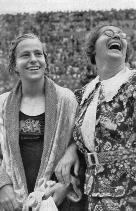 Framed Print : Dina Senff (Holland) and her coach are happy about winning the 100-metre backstroke