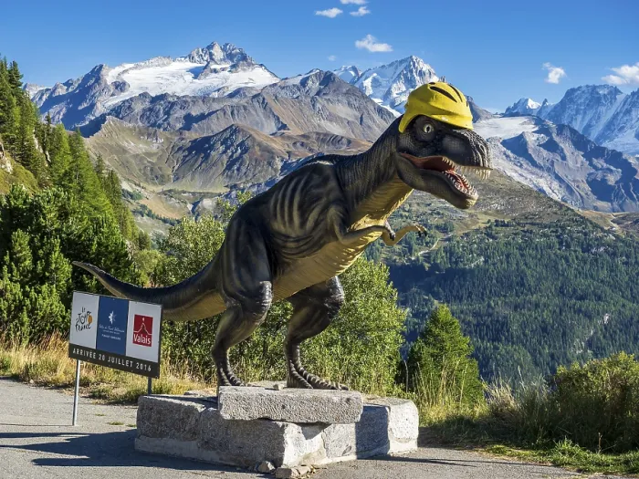 Framed Print : Dinosaur sculpture a barrage de Emosson in front of snow covered mountains