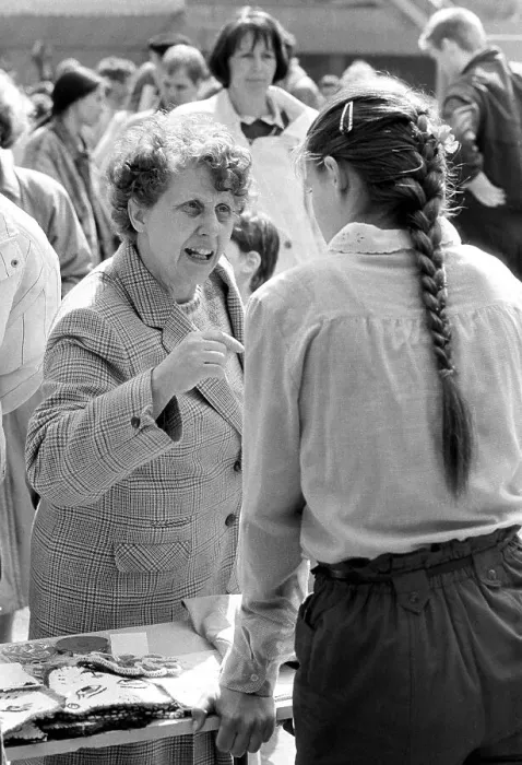 Framed Print : Discussion at a street festival Framed Print : Discussion at a street festival