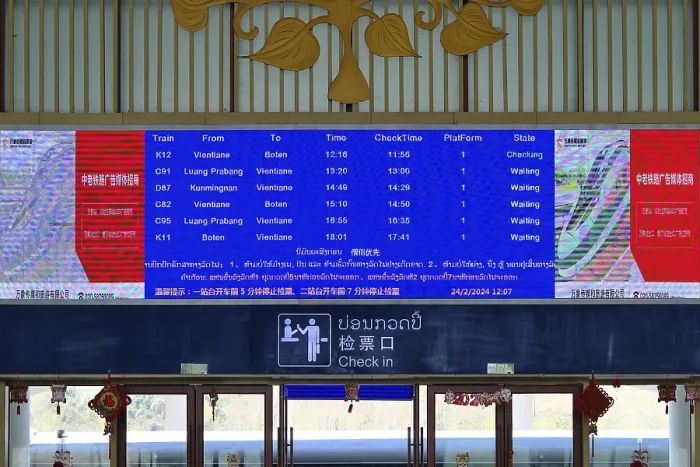 Framed Print : Display board in English in the waiting hall of the modern railway station of Luang Prabang of the Laos-China Railway