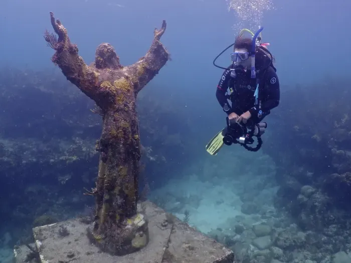 Framed Print : Diver looking at the statue of Jesus Christ underwater (Christ of the Abyss)