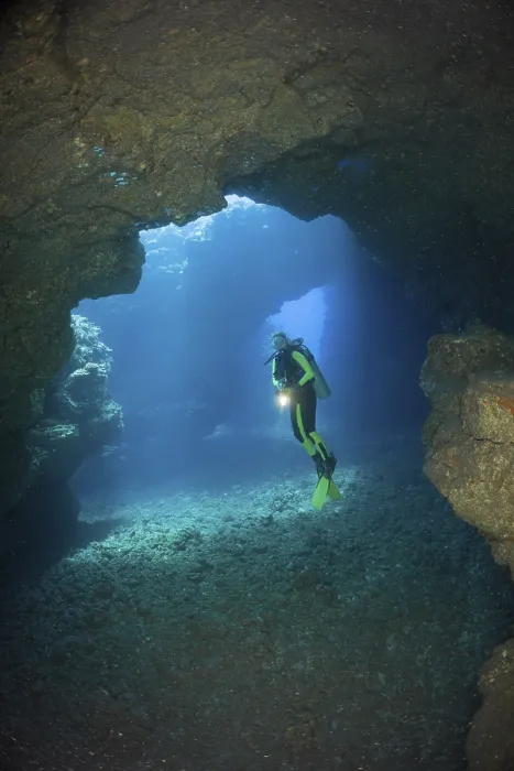 Framed Print : Diver in underwater lava cave, Lani Cathedral