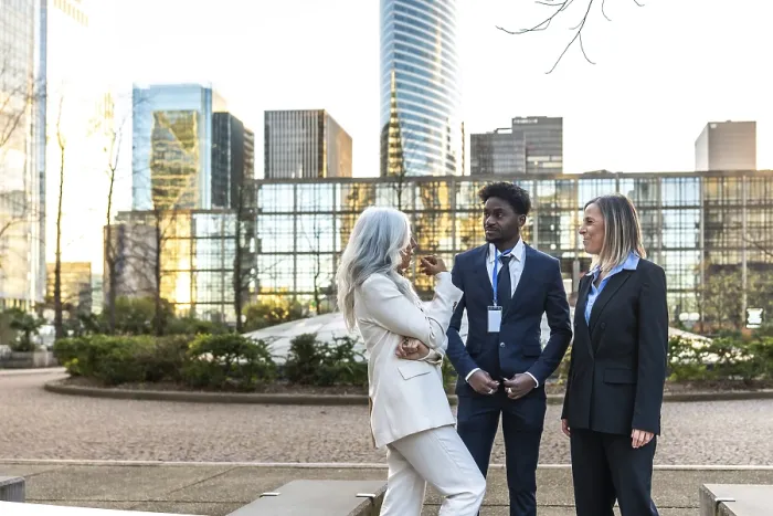 Framed Print : Diverse business professionals conducting an informal meeting