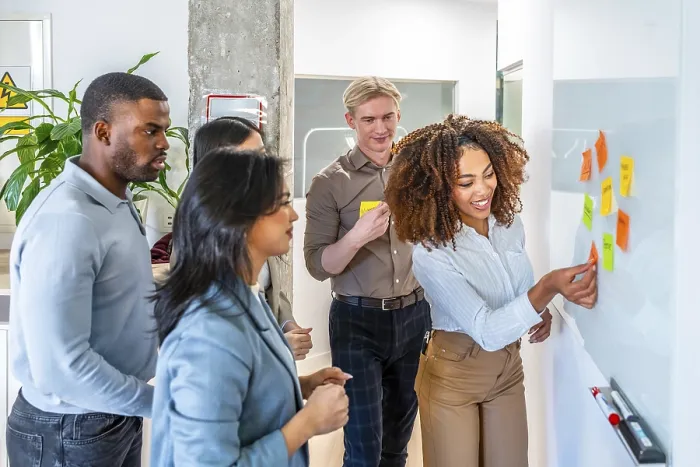 Framed Print : Diverse team collaborating